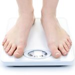 Person Standing on a Weight Scale